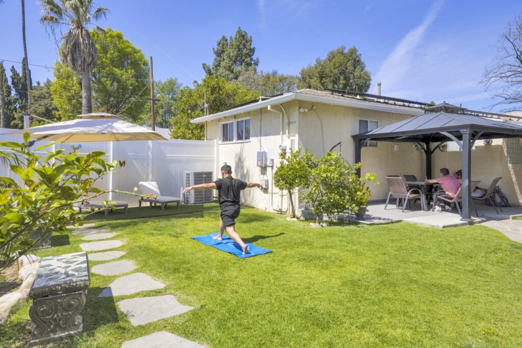 Outdoor yoga in the backyard at Believe Detox Center Granada Hills